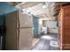 Basement area with appliances, concrete walls, wood ceiling beams and showing various utilities at 119 Meadowbrook Ln, Davidson, NC 28036