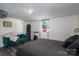 Finished basement bedroom showcasing modern furnishings, a dark ceiling, and natural light at 119 Meadowbrook Ln, Davidson, NC 28036