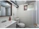 Finished basement bathroom features a functional layout with a sink, toilet, and shower at 119 Meadowbrook Ln, Davidson, NC 28036