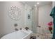 Modern bathroom with a separate tub and shower, showcasing updated fixtures and tile work at 119 Meadowbrook Ln, Davidson, NC 28036