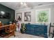 Bedroom featuring a large dresser, golf clubs, and decor under a ceiling fan near a window at 119 Meadowbrook Ln, Davidson, NC 28036