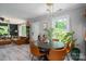 Open-concept dining area with a view of the living room, blending comfort and style at 119 Meadowbrook Ln, Davidson, NC 28036