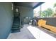 Garage with stairs leading to a door and storage area for outdoor equipment like a bicycle at 119 Meadowbrook Ln, Davidson, NC 28036