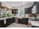 Stylish kitchen featuring sleek cabinetry, a farmhouse sink, and contemporary finishes at 119 Meadowbrook Ln, Davidson, NC 28036