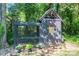 Aesthetic outbuilding with a fenced in area, perfect for a small animal sanctuary at 119 Meadowbrook Ln, Davidson, NC 28036
