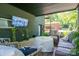 Covered patio featuring a wall-mounted TV and comfortable seating ideal for entertaining guests at 119 Meadowbrook Ln, Davidson, NC 28036