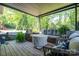 Charming covered patio featuring comfortable seating options perfect for relaxing outdoors at 119 Meadowbrook Ln, Davidson, NC 28036