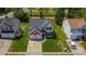 Aerial view of a well-maintained home with an attached garage, surrounded by trees and lawns at 1216 Stourbridge Lion Dr, Charlotte, NC 28213