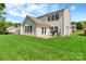 Spacious backyard with a patio, grill, and well maintained lawn at 1216 Stourbridge Lion Dr, Charlotte, NC 28213