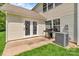Exterior of home with a well-kept lawn, patio and gas grill at 1216 Stourbridge Lion Dr, Charlotte, NC 28213