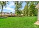 Expansive backyard with lush green lawn near construction site at 1216 Stourbridge Lion Dr, Charlotte, NC 28213