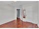 This bedroom boasts hardwood floors and a view to an adjacent space at 1216 Stourbridge Lion Dr, Charlotte, NC 28213