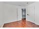 Bedroom with hardwood flooring, neutral paint, and doors to an adjacent space at 1216 Stourbridge Lion Dr, Charlotte, NC 28213