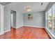 Well-lit room with hardwood floors, a large window, and neutral paint, ready for customization at 1216 Stourbridge Lion Dr, Charlotte, NC 28213
