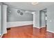Spacious room with hardwood floors and custom molding; the perfect space for entertaining or relaxation at 1216 Stourbridge Lion Dr, Charlotte, NC 28213