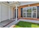 Close-up of the front entrance featuring a classic brick facade and manicured landscaping at 1216 Stourbridge Lion Dr, Charlotte, NC 28213