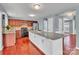Spacious kitchen with granite counters, cherry wood cabinets, stainless appliances and an oversized center island at 1216 Stourbridge Lion Dr, Charlotte, NC 28213