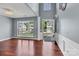 Inviting living room featuring hardwood floors, large windows, and elegant architectural details at 1216 Stourbridge Lion Dr, Charlotte, NC 28213