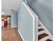 A staircase features wood treads and white risers and handrail at 1216 Stourbridge Lion Dr, Charlotte, NC 28213