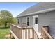 View of a home's back deck, showcasing the outdoor living space and backyard at 123 Pumice Dr, Statesville, NC 28625