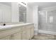 Bathroom featuring double vanity and a tiled shower at 123 Pumice Dr, Statesville, NC 28625