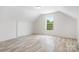 Spacious upper bedroom with a large window and closet for ample storage at 123 Pumice Dr, Statesville, NC 28625