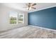 Bedroom with modern wall color and two bright windows at 123 Pumice Dr, Statesville, NC 28625