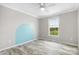 A cozy bedroom featuring an arch accent wall and ample natural light at 123 Pumice Dr, Statesville, NC 28625
