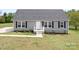 Charming single-story home with gray siding, a gray roof, and a well-manicured lawn at 123 Pumice Dr, Statesville, NC 28625