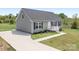 Charming single-story home with gray siding, black shutters, and a well-manicured front yard at 123 Pumice Dr, Statesville, NC 28625