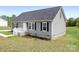 Well maintained single-story home featuring black shutters and manicured landscaping at 123 Pumice Dr, Statesville, NC 28625