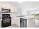 View of the kitchen with subway tile backsplash and stainless steel appliances at 123 Pumice Dr, Statesville, NC 28625