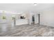 Open-concept living space with natural light and attractive flooring at 123 Pumice Dr, Statesville, NC 28625