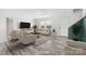 Staged living room with neutral furniture, modern decor, and ample natural light at 123 Pumice Dr, Statesville, NC 28625