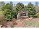 Stone sign surrounded by lush landscaping welcoming you to River Rock at 123 Pumice Dr, Statesville, NC 28625