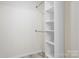 View of the walk-in closet space with storage shelves at 123 Pumice Dr, Statesville, NC 28625