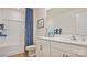 Stylish bathroom with double vanity, tub, and shower featuring white cabinets at 14018 Wilson Mac Ln, Charlotte, NC 28278