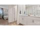 Contemporary bathroom featuring a double vanity with ample storage, tile flooring, and an adjoining bedroom at 14018 Wilson Mac Ln, Charlotte, NC 28278