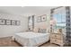 Comfortable bedroom with a queen bed, coordinating drapes, and bedside lamps, offering a serene retreat at 14018 Wilson Mac Ln, Charlotte, NC 28278