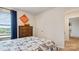 Bright bedroom featuring a construction theme, a dresser, and a window at 14018 Wilson Mac Ln, Charlotte, NC 28278