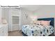 Cozy bedroom with a cheerful decor, featuring a floral patterned bedspread and plush accents for a snug space at 14018 Wilson Mac Ln, Charlotte, NC 28278