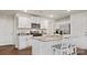 Modern kitchen with white cabinets, granite countertops, stainless steel appliances, and a kitchen island with seating at 14018 Wilson Mac Ln, Charlotte, NC 28278