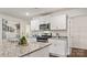 Well-equipped kitchen featuring white cabinets, granite countertops, and stainless steel appliances at 14018 Wilson Mac Ln, Charlotte, NC 28278