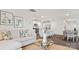 Open-concept living space with a sofa, kitchen island, dining area, and modern decor at 14018 Wilson Mac Ln, Charlotte, NC 28278