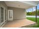 Back patio area with gray vinyl siding looking out to a grassy, fenced backyard at 141 Ivy Creek Ln, Mooresville, NC 28115