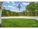 Well-maintained backyard with lush green grass and a tall privacy fence at 141 Ivy Creek Ln, Mooresville, NC 28115