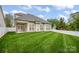 Spacious backyard featuring a well-manicured lawn and a privacy fence at 141 Ivy Creek Ln, Mooresville, NC 28115