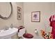Powder room features stylish fixtures, a pedestal sink, and elegant decor at 141 Ivy Creek Ln, Mooresville, NC 28115