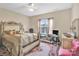 Cozy bedroom with ceiling fan and window providing natural light at 141 Ivy Creek Ln, Mooresville, NC 28115
