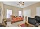 Well-lit bedroom with a ceiling fan, a window, and a closet with doors at 141 Ivy Creek Ln, Mooresville, NC 28115
